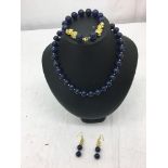 A lapis lazuli necklace;