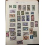 A World stamp album in green leather to inc France, French Colonials, Hungary, Germany, Holland,