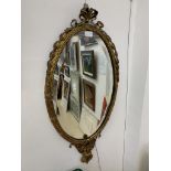 A gilt framed mirror