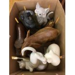 A box of carved and ceramic animals