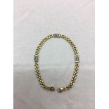 A gold and emerald bracelet