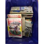 A box of football programmes;