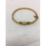 A 15ct diamond set Victorian bangle