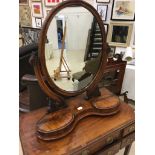 A mahogany swing mirror