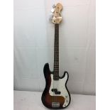 An Encore electric bass guitar