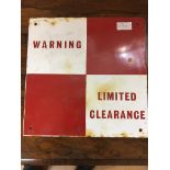An enamel sign: 'Limited Clearance'