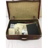 A suitcase containing photograph albums and photographs to inc theatrical-related examples