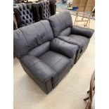A pair of leatherette reclining chairs