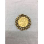 A 1900 gold sovereign in a 9ct gold mount