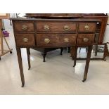 A George III mahogany six-drawer chest on tapered legs with castors