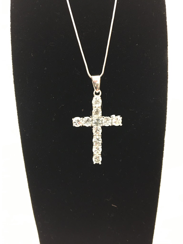 A new Aguilera silver cross and white topaz