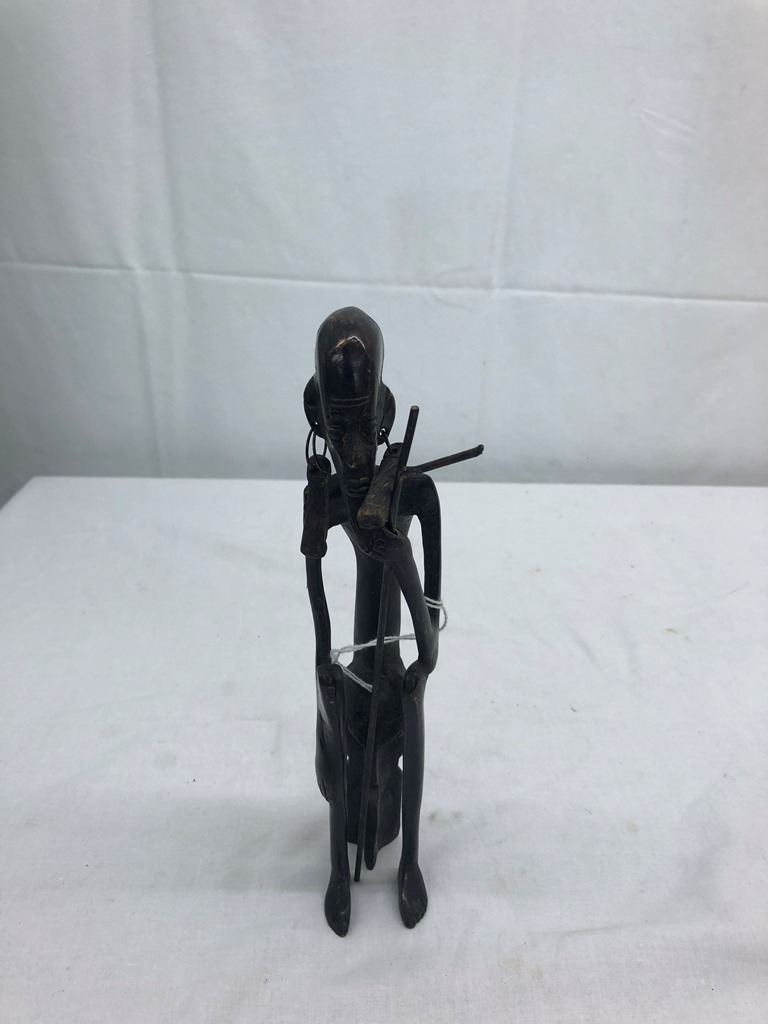 A cast metal African figure