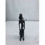 A cast metal African figure