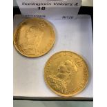 Two large gold coins dated 1887.