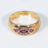 An 18ct gold ring set with rubies and diamonds, size L