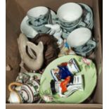 A box containing tea ware and other pottery items