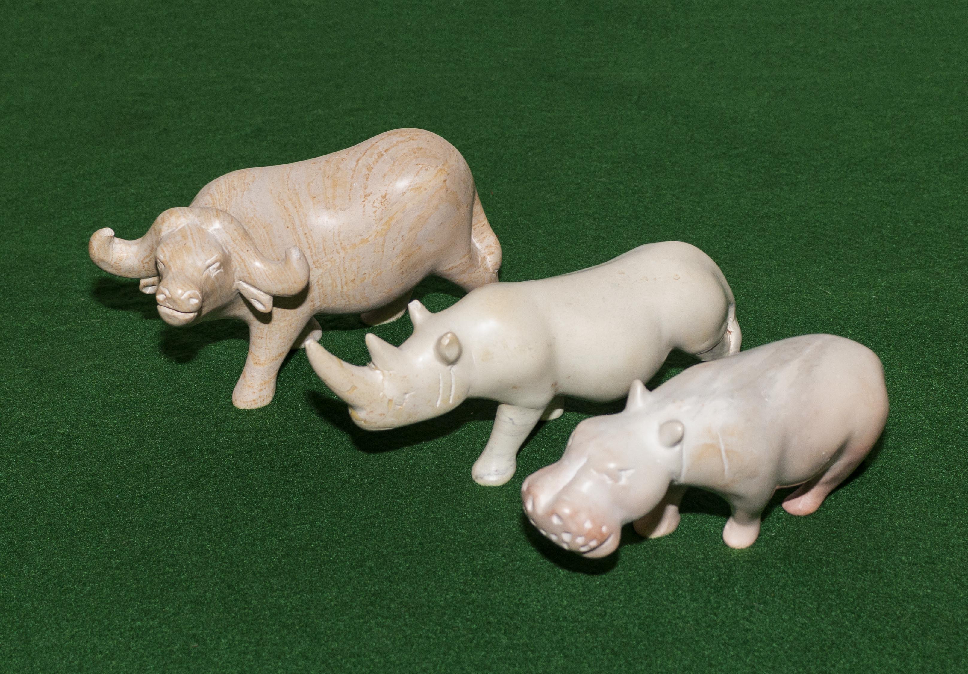 Three pottery African animals.