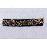 A 9ct gold bracelet set with amethyst