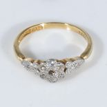 An 18ct gold ring set with diamonds, size M