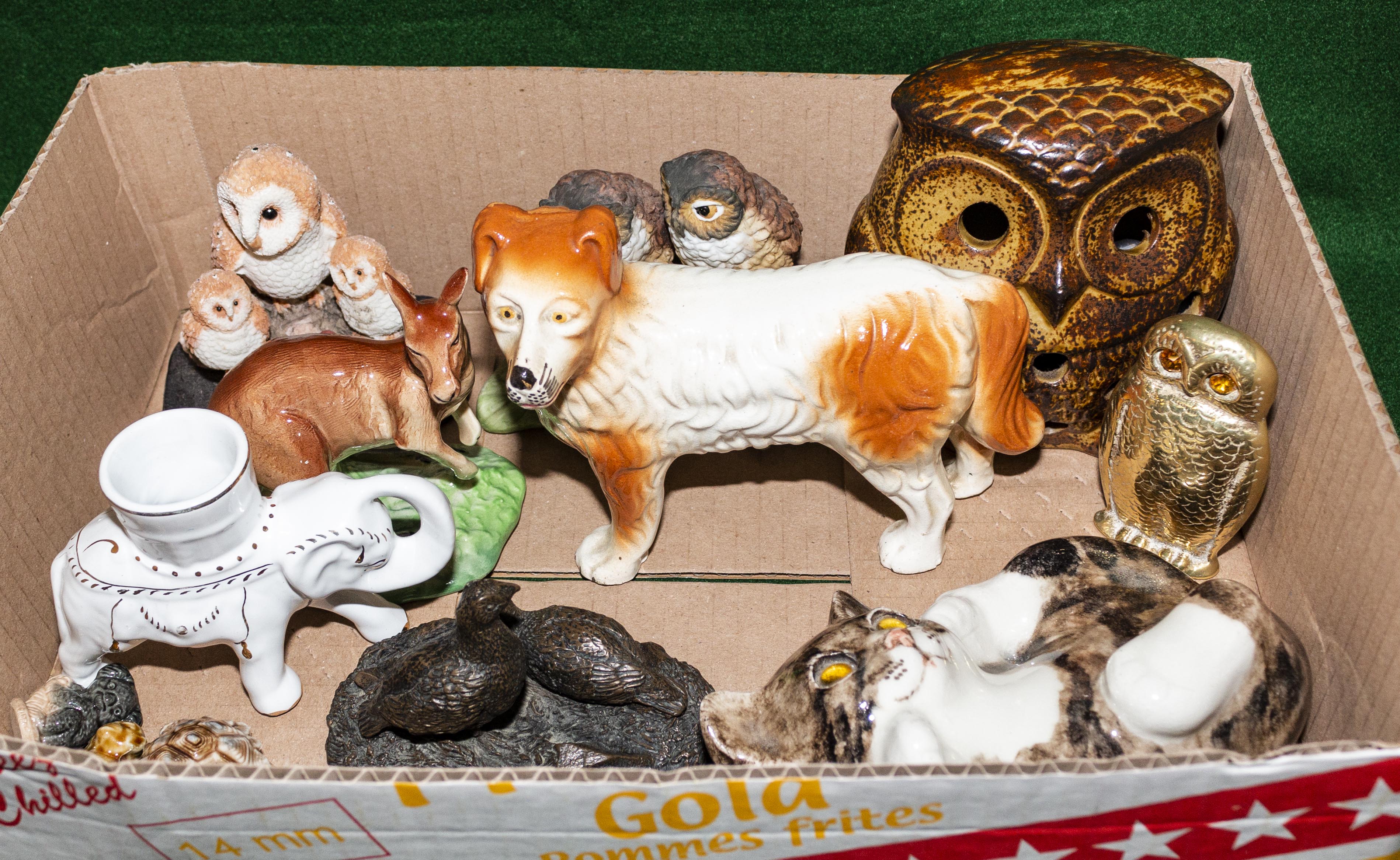 A box containing pottery animals