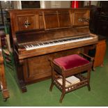 A rosewood piano with stool.