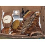 A box containing wooden carvings and other items