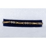 A 9ct gold and diamond bracelet