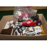 A box containing model cars and other items