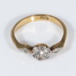 An 18ct gold ring set with diamonds, size N