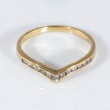 An 18ct gold ring set with diamonds, size N