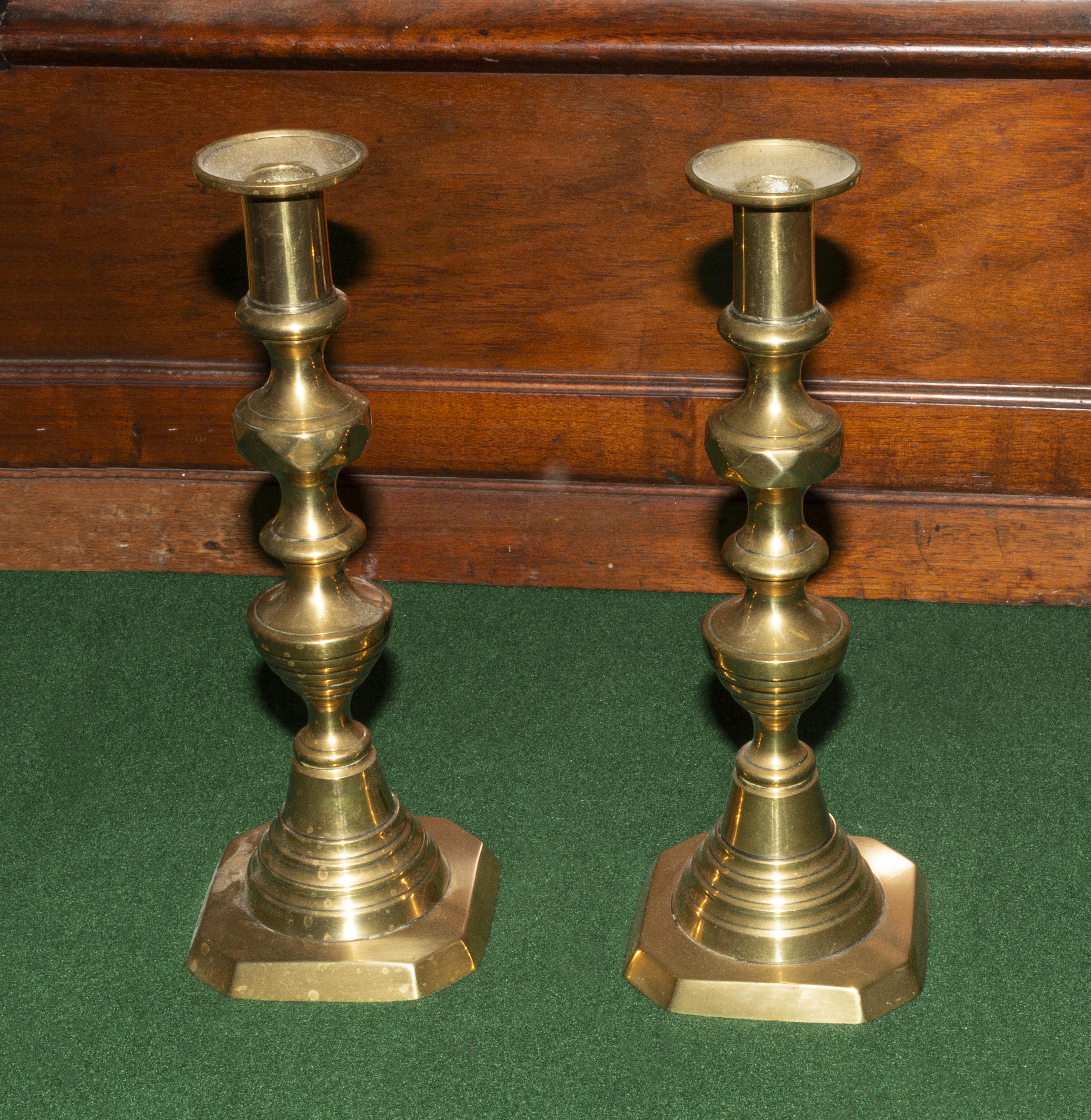 A pair of brass candlesticks