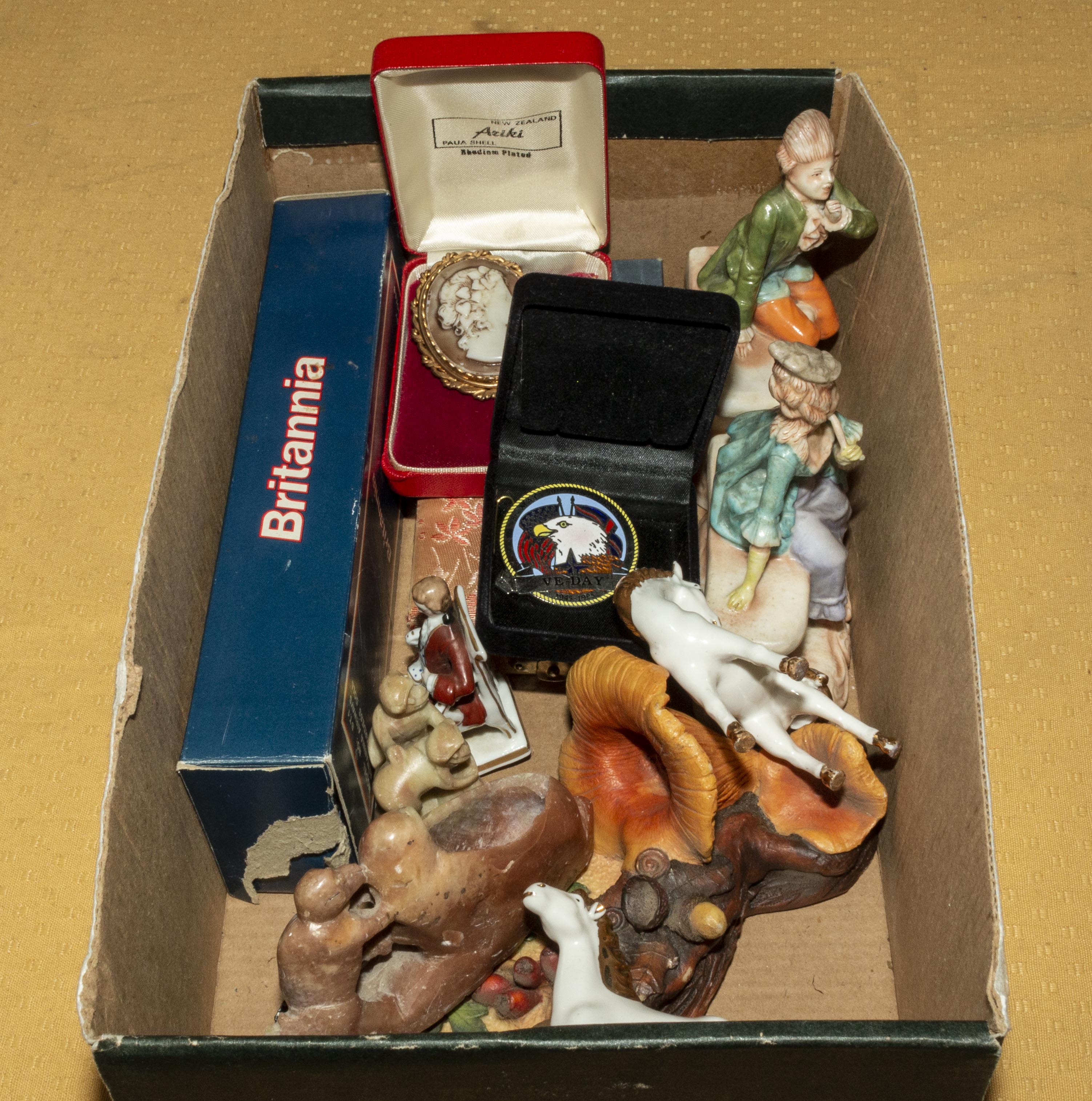 A box containing pottery and other assorted items