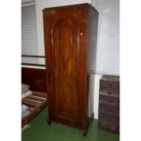 A Victorian mahogany single door wardrobe.