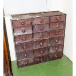 A late Victorian bank of pine drawers.