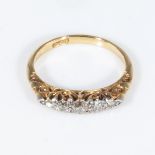 An 18ct gold ring set with diamonds, size N