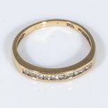 An 18ct gold ring set with diamonds, size M