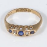 An 18ct gold ring set with three sapphires and two diamonds, size M