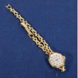 A lady's gold metal watch