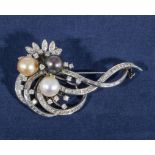 An 18ct white gold diamond and pearl brooch/pendant