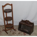 A folding three tier cake stand together with small cabinet