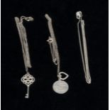 Three silver chains and pendants
