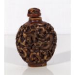 A carved Chinese snuff bottle