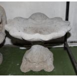 A re-constituted stone garden bird bath