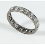 An 18ct white gold 1.25 carat full eternity ring, size O