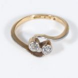 An 18ct gold twist ring set with two diamonds, size L