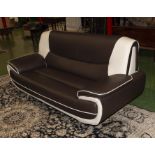 A retro brown and cream faux leather sofa