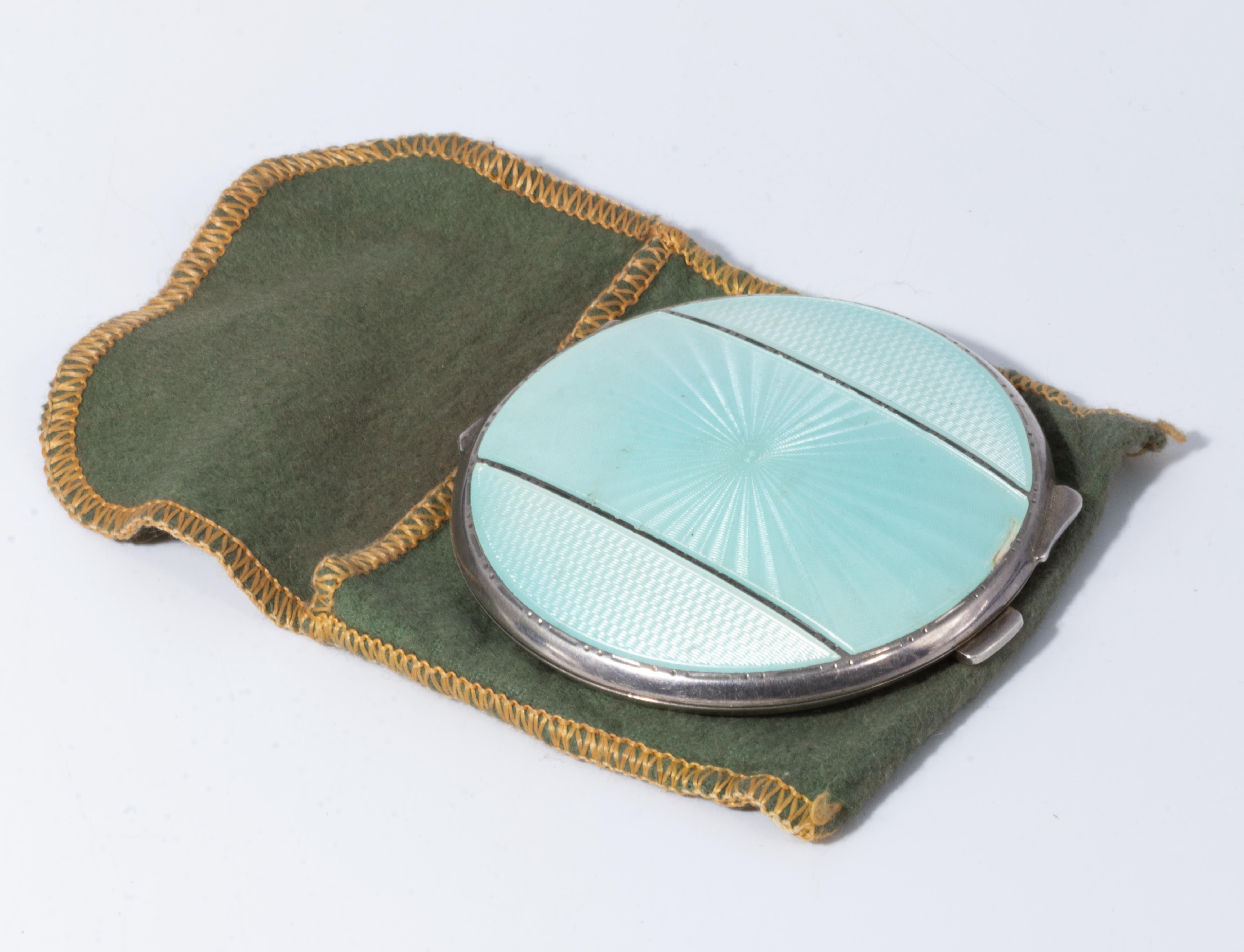 A silver enamel powder compact