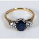 An 18ct gold sapphire and diamond three stone ring, size P
