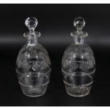 A pair of etched glass decanters
