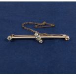 A 15ct gold bar brooch set with five diamonds, 40 point
